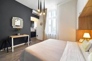 Posteľ alebo postele v izbe v ubytovaní Time Apartments Downtown