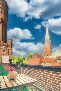 a pumpkin sitting on a bench in front of a castle at Stadtblick in Lüneburg