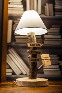 a lamp on a table with signs on it at Hotel Rio Bidasoa in Hondarribia