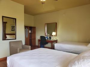 Postel nebo postele na pokoji v ubytování Rolson Hotel