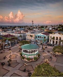 a city square with a building in the middle at Hotel Victoriano in San Felipe de Puerto Plata