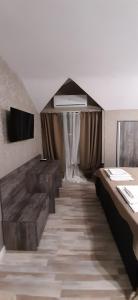 A bed or beds in a room at Vida Family Hotel