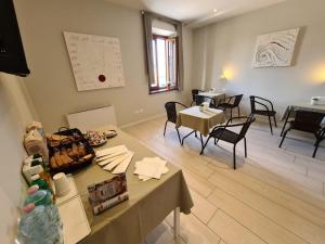 a room with two tables and chairs and a table with at B&B Locanda de' Colli in Signa