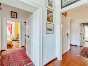 a hallway with white walls and a red rug at Wohnung in Riedenburg nahe Schloss Rosenburg in Riedenburg