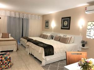 Cama o camas de una habitación en Suítes Veneza