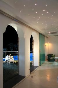 a living room with a view of the ocean at Hotel La Floridiana in Capri