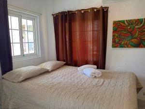 Posteľ alebo postele v izbe v ubytovaní Hotel Cocotal