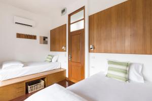 Ein Bett oder Betten in einem Zimmer der Unterkunft Hidden Garden Hostel