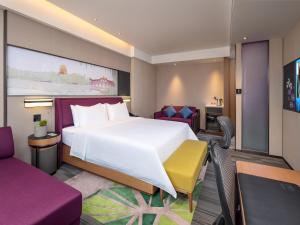 Posteľ alebo postele v izbe v ubytovaní Hampton by Hilton Qinhuangdao Jinmeng Bay