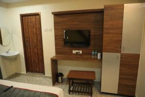 TV a/nebo společenská místnost v ubytování Hotel Kheni