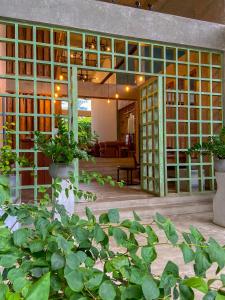 a building with green plants in front of it at Coza Ceylon in Mount Lavinia