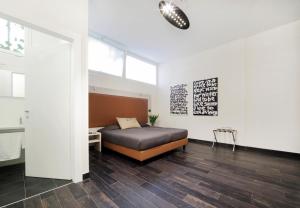 Posteľ alebo postele v izbe v ubytovaní Borgo Pio Suites Inn