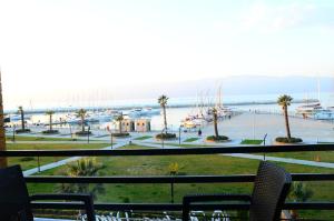 a view of a marina from a balcony at Burhaniye Marina Boutique Hotel in Burhaniye