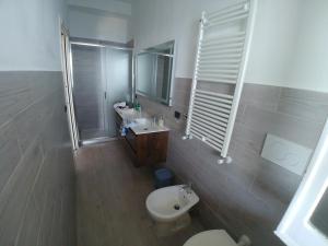 a bathroom with a toilet and a sink and a shower at GIARDINO SUL MARE in Amalfi