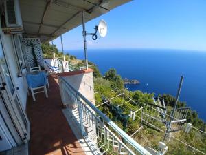 a balcony of a house with a view of the ocean at GIARDINO SUL MARE in Amalfi