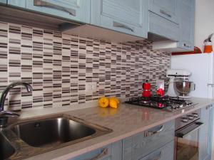 a kitchen with a sink and a counter top at GIARDINO SUL MARE in Amalfi