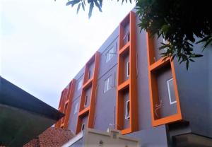 a building with orange accents on the side of it at Giant Kost in Tangerang