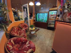TV i/ili multimedijalni sistem u objektu Hotel Oswaldo