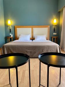 Postel nebo postele na pokoji v ubytování Olympic Hotel