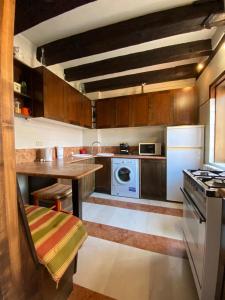 a kitchen with a table and a stove top oven at Cà Francesco Apartment in Venice