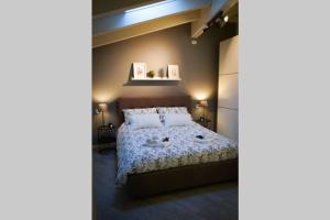 Posteľ alebo postele v izbe v ubytovaní L'Attico del Lago