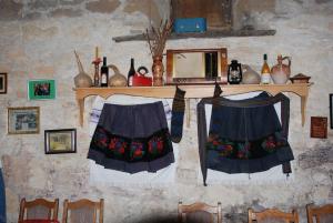 two skirts are hanging on a wall at "Pivnica i smestaj Jovanovic"- Rogljevacke pivnice in Rogljevo