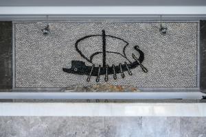 a picture of a basketball hoop on a wall at Pedi Beach Hotel in Symi