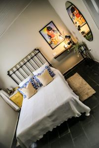 a bedroom with a large bed and a lamp at Casa de Arriba in Rinlo