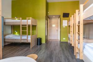 Postel nebo postele na pokoji v ubytování MEININGER Hotel Berlin Mitte