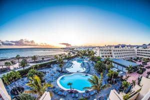 an aerial view of a resort with a pool and the beach at Hotel Beatriz Playa & Spa in Puerto del Carmen