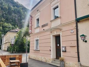 a building with a sign on the side of it at AMADEA - Cityhotel Salzburg in Salzburg