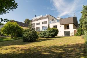 a large white house with a yard at Yes, it is RETRO - Big Villa with Indoor Pool in Vienna