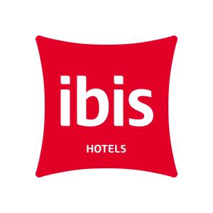 a red pillow with the word h hotels at ibis Berlin City Nord in Berlin