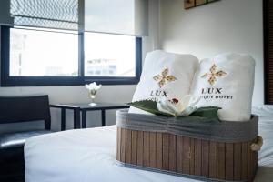 Postel nebo postele na pokoji v ubytování Lux Boutique Hotel