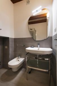 a bathroom with a sink and a mirror at La Cava dei Sogni in Orvieto