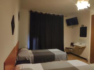 A bed or beds in a room at Fonda Ca La Maria