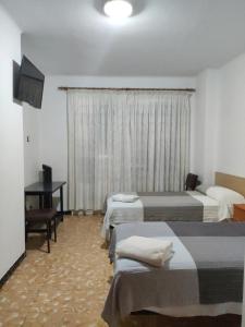 A bed or beds in a room at Fonda Ca La Maria