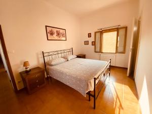 A bed or beds in a room at B&B Villino Margherita