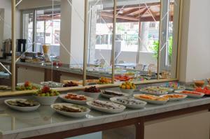 a buffet with many bowls of food on a table at Afsin Hotel in Antalya