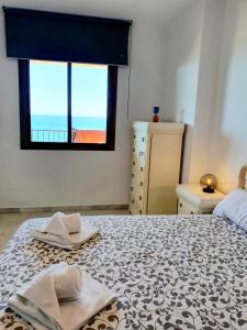 Łóżko lub łóżka w pokoju w obiekcie Carvajal Seaviews
