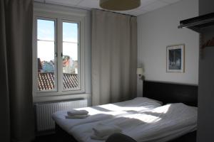 Postel nebo postele na pokoji v ubytování Grännagården Hotell och Restaurang + 30 fotografií