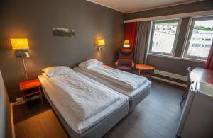 Postel nebo postele na pokoji v ubytování F2 Hotel