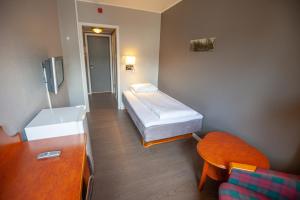 Postel nebo postele na pokoji v ubytování F2 Hotel