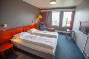 Postel nebo postele na pokoji v ubytování F2 Hotel