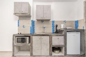 Kuchyň nebo kuchyňský kout v ubytování N RENIERIS Apartments + 37 fotografií