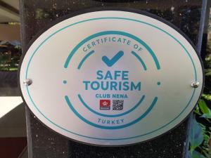 a sign for a safe tourism club nepal at Club Nena - All Inclusive in Kizilagac