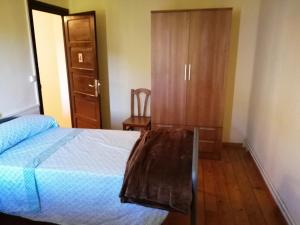 Ένα ή περισσότερα κρεβάτια σε δωμάτιο στο Labaiengo Ostatua