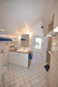 a bathroom with a sink and a toilet at Ferienwohnungen Abraham in Lübeck