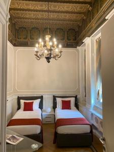 En eller flere senger på et rom på Loger Confort Residence & Apartments