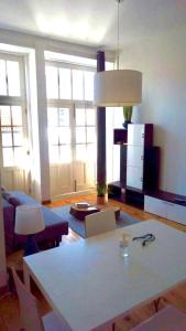 a living room with a couch and a table at Historical Porto Apartment in Porto